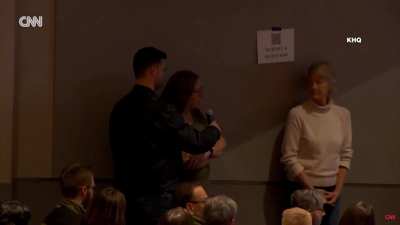 Americans defend Canadians and wave flag at town hall in Spokane, Washington