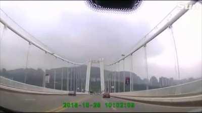 Bus in China plunges into river after passenger and driver fight