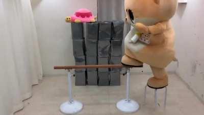 To walk across a wooden rail whilst wearing a Chiitan suit