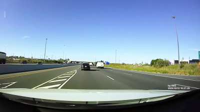 Single person car (non green plate) cutting to HOV lane without looking