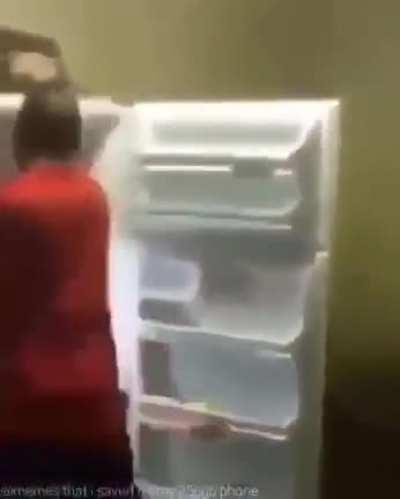 Drunk guy fights fridge