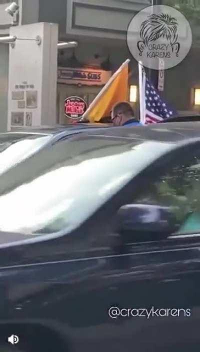 Karen in Downtown Greenville SC upset because she is being given a ticket for obstructing her view by coving her windows with Anti-Covid signs.