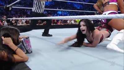 Aj Lee laughs at Paige subdued by Natalya