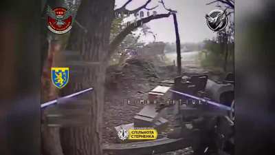 Ukrainian FPV pilots from the 103rd Territorial Defense Brigade attack a Russian truck hidden in a building, two towed howitzers, and a dugout position using fiber optic UAVs. Sumy Oblast.