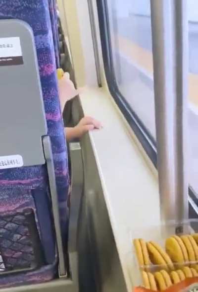 Little girl offering her nursing bottle for a cookie