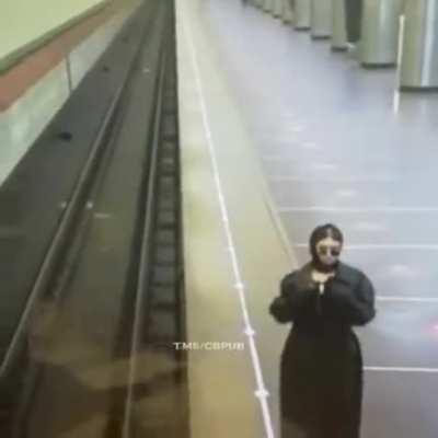 Russian woman cheering up her boyfriend who works in metro security