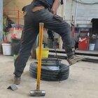 Trying to pry a tire from a rim