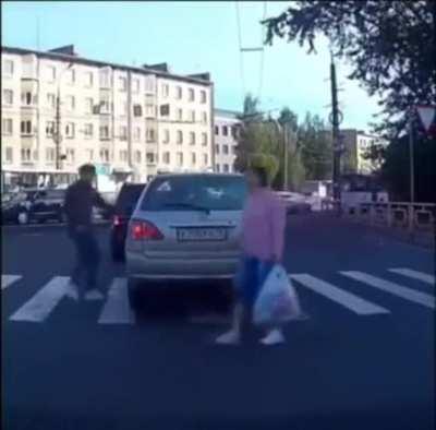 Blocking pedestrian crossing.