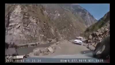 Boulder Falls In Front Of Truck