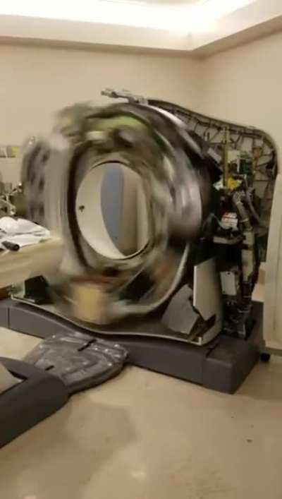 computerized tomography (CT) scan machine with the covers removed.