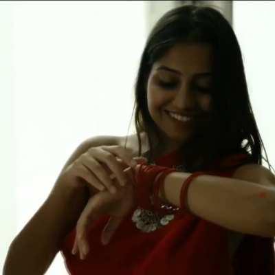Red saree and nothing else under while wearing jewellery
