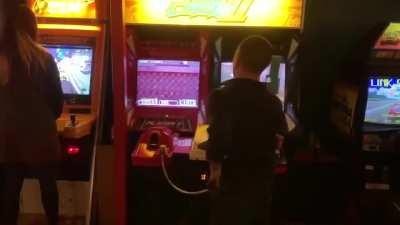 This guy rides solo up into the arcade, walks up to TIME CRISIS and plays the game start to finish on one coin using both guns. That means he's players 1 and 2 at the same time.