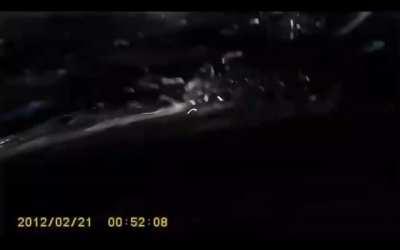 Russia: Car gets crushed under a truck