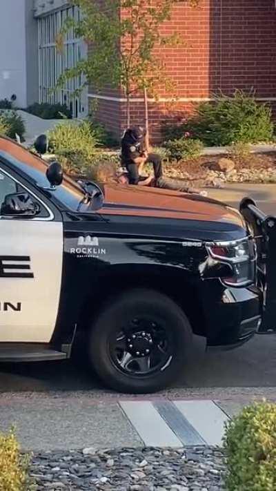 Cop points gun at surrendering young man then tries to break his arm.