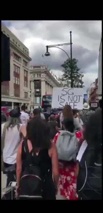 A protest in the UK about wearing masks (muzzles).