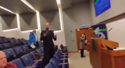 A law student questions a group of 