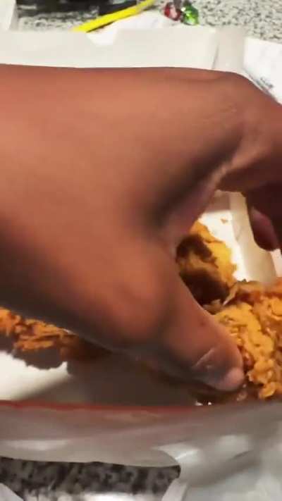 Popeyes gave her a whole chicken, with the beak.