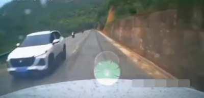 truck hits biker. launches him off a cliff