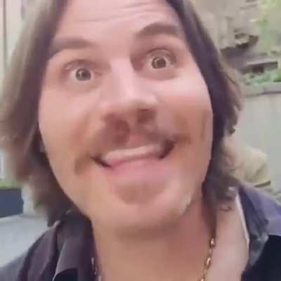 Person in a yellow coat is thrilled to get a gift of Mao's Little Red Book in China (75 *million* dead civilians)