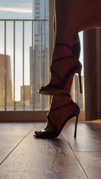 Black Jimmy Choo’s and the light peeking through my arches