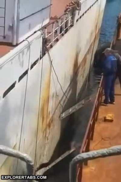 Boarding a boat on a rusty ol' ladder