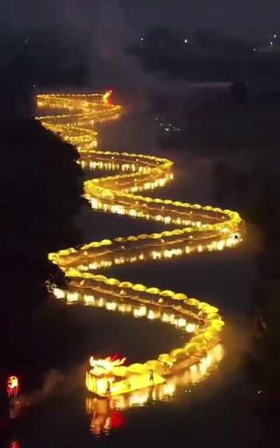 Eighty bamboo rafts created this 70-metre dragon, winding down the Yulong River
