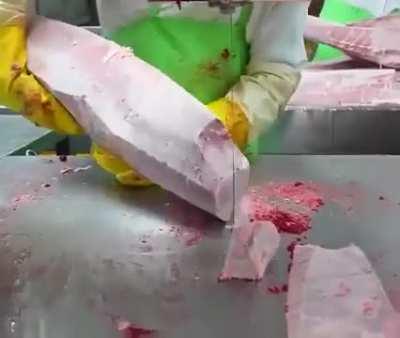 Cutting up tuna at a Japanese Factory
