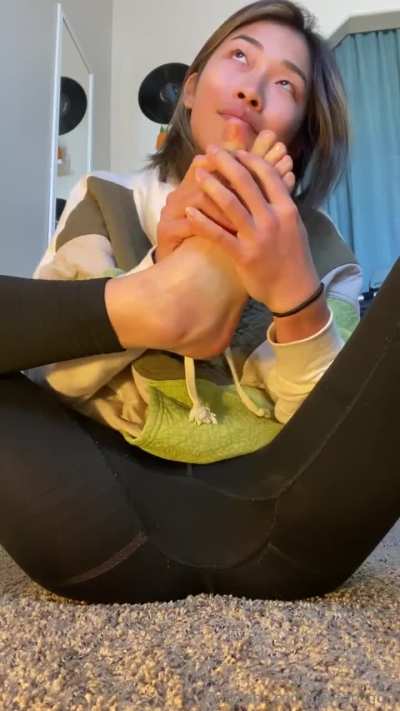 Asian self smelling feet