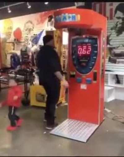 Aww...a dad showing his son how strong he is!