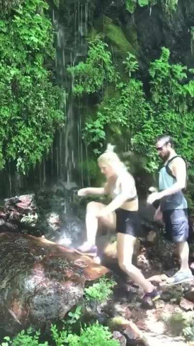 trying to climb slippery rocks