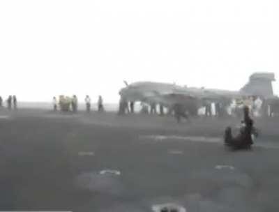 Standing behind a jet engine.