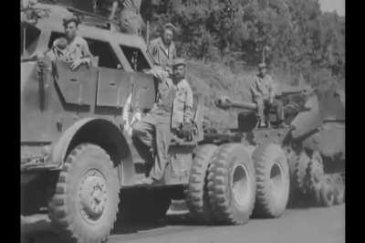 Ward LaFrance M1A1 Wrecker and M26 armored tractor towing a knocked out Elefant tank destroyer near Rome in June 1944