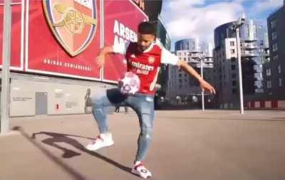 Arsenal fans celebrating their club’s promotion to the 2036 Premier League season. (emotional)