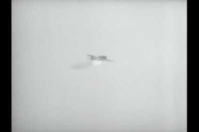 Yokosuka D4Y kamikaze struck by gunfire as and barely misses USS Yorktown (CV-10) in early 1945