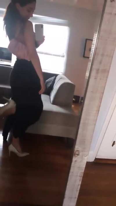 Showing her dress for the night