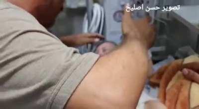 This father sees his only child who survived the Israeli airstrike on gaza refugee camp, his wife and his 4 other kids have died