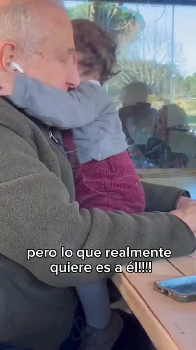The grandfather thought his grandson was reaching for his headphones, but the boy only wanted to give him a hug