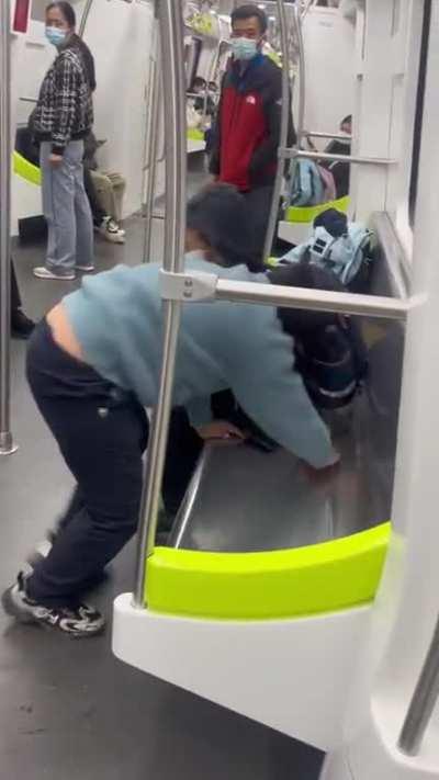 Kid was trying to do pull ups in subway train but failed tragically 