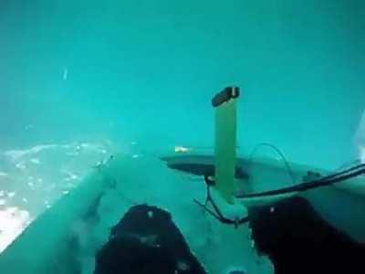 Kid recovers sailboat after capsizing