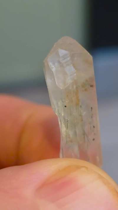 Terminated clear quartz, heavily included with rutile, actinolite, and goethite