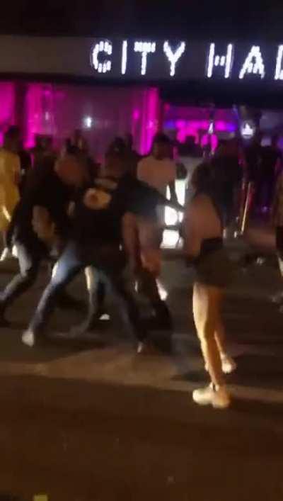 drunk girl trying to knock out a security guy with her handbag