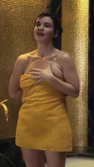 Lily James nearly drops her towel