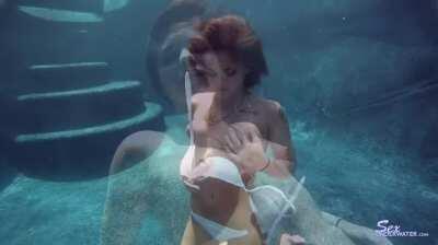 Shawna Hill stripping underwater