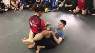 Girl dominates guy in Jiujitsu