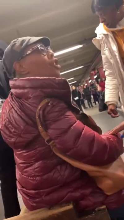 NYC Young woman and older woman argue over a bench