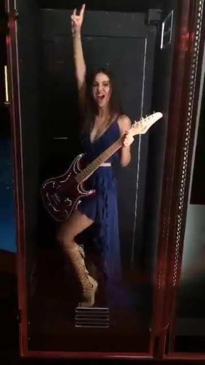 Strumming her 6 String