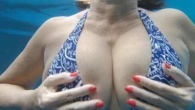 In the pool with my DD boobs and a new blue bikini....let me know what you think?