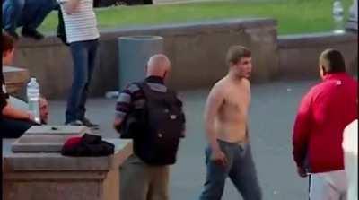 Shirtless guy struts around randomly assaulting people until someone decided he needed to take a nap
