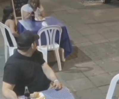 Young girl gives her meal to a needy elderly woman