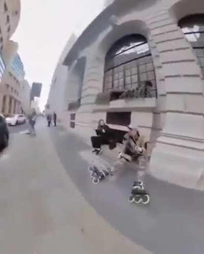 WCGW skating between a parked car and the side walk
